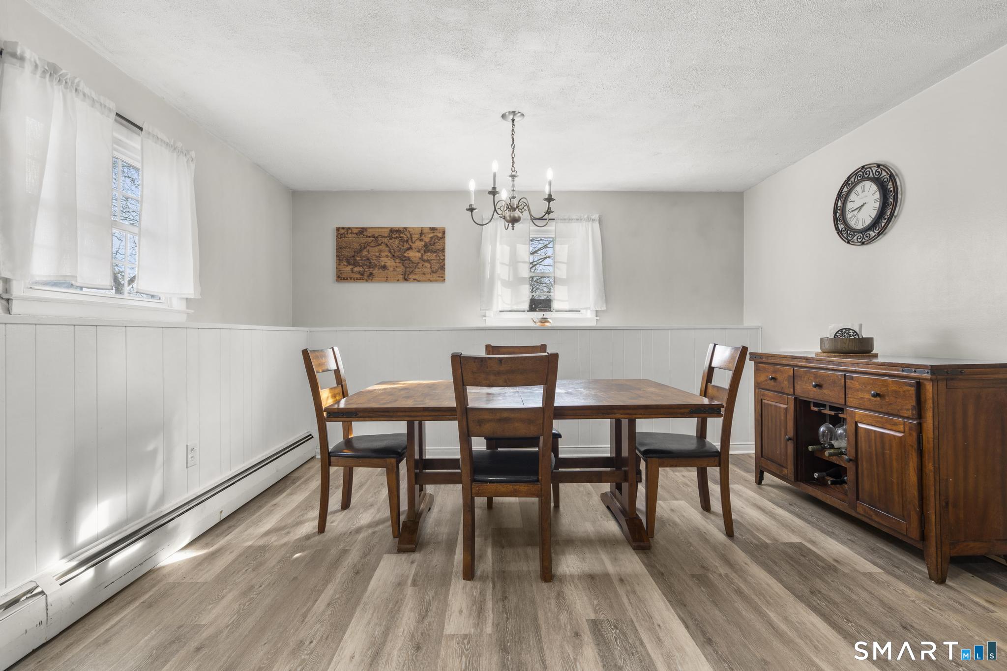 89 Green Meadow Road Milford, CT 06461 - Photo 11 of 31 a view of a dining room with furniture window and wooden floor