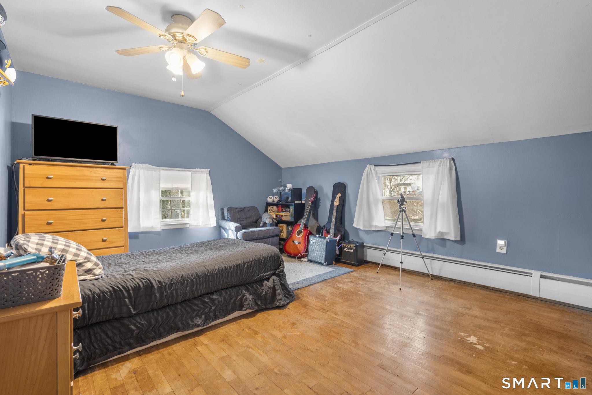 89 Green Meadow Road Milford, CT 06461 - Photo 22 of 31 a bedroom with bed and window