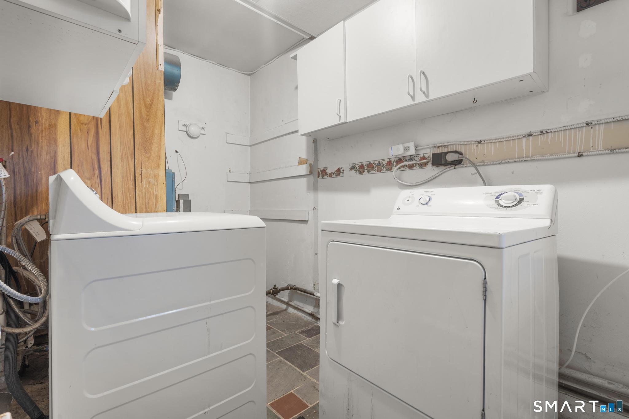 89 Green Meadow Road Milford, CT 06461 - Photo 24 of 31 a utility room with dryer and washer