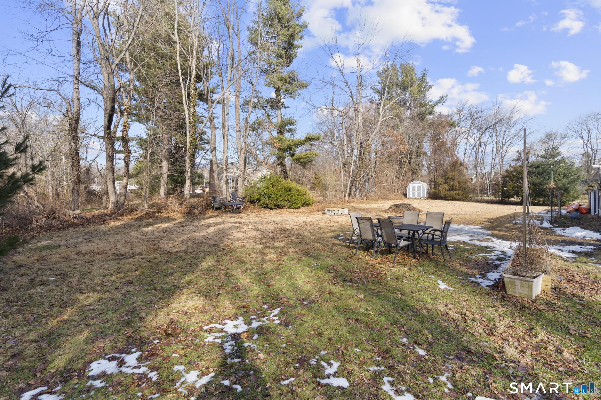 89 Green Meadow Road Milford, CT 06461 - Photo 28 of 31 a view of a outdoor space with patio and wooden fence