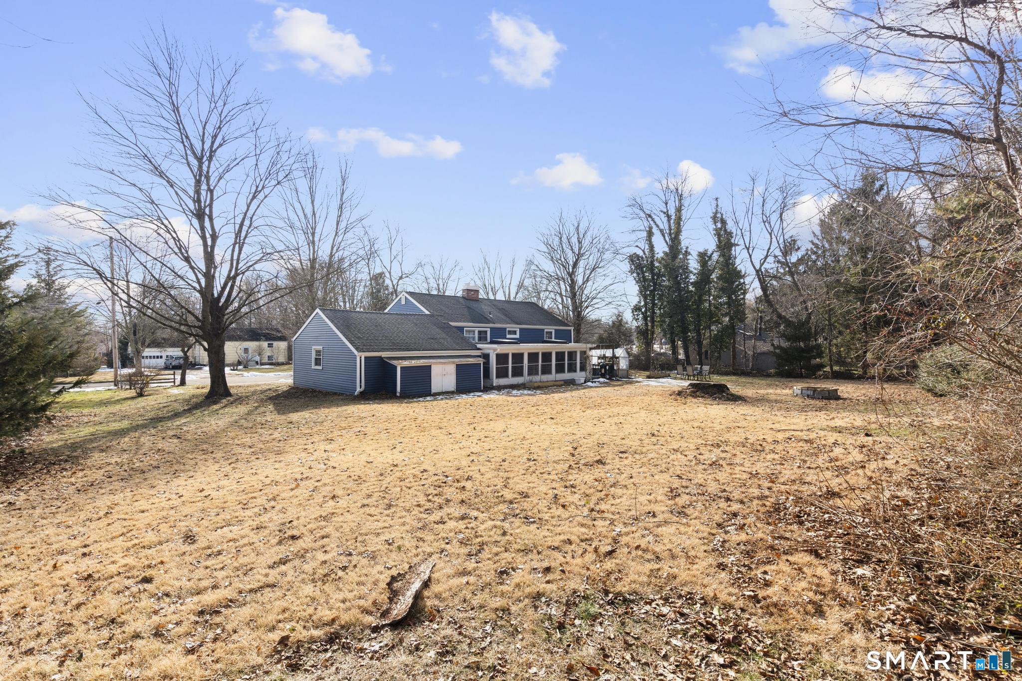 89 Green Meadow Road Milford, CT 06461 - Photo 29 of 31 a house with a yard covered with snow in front of house