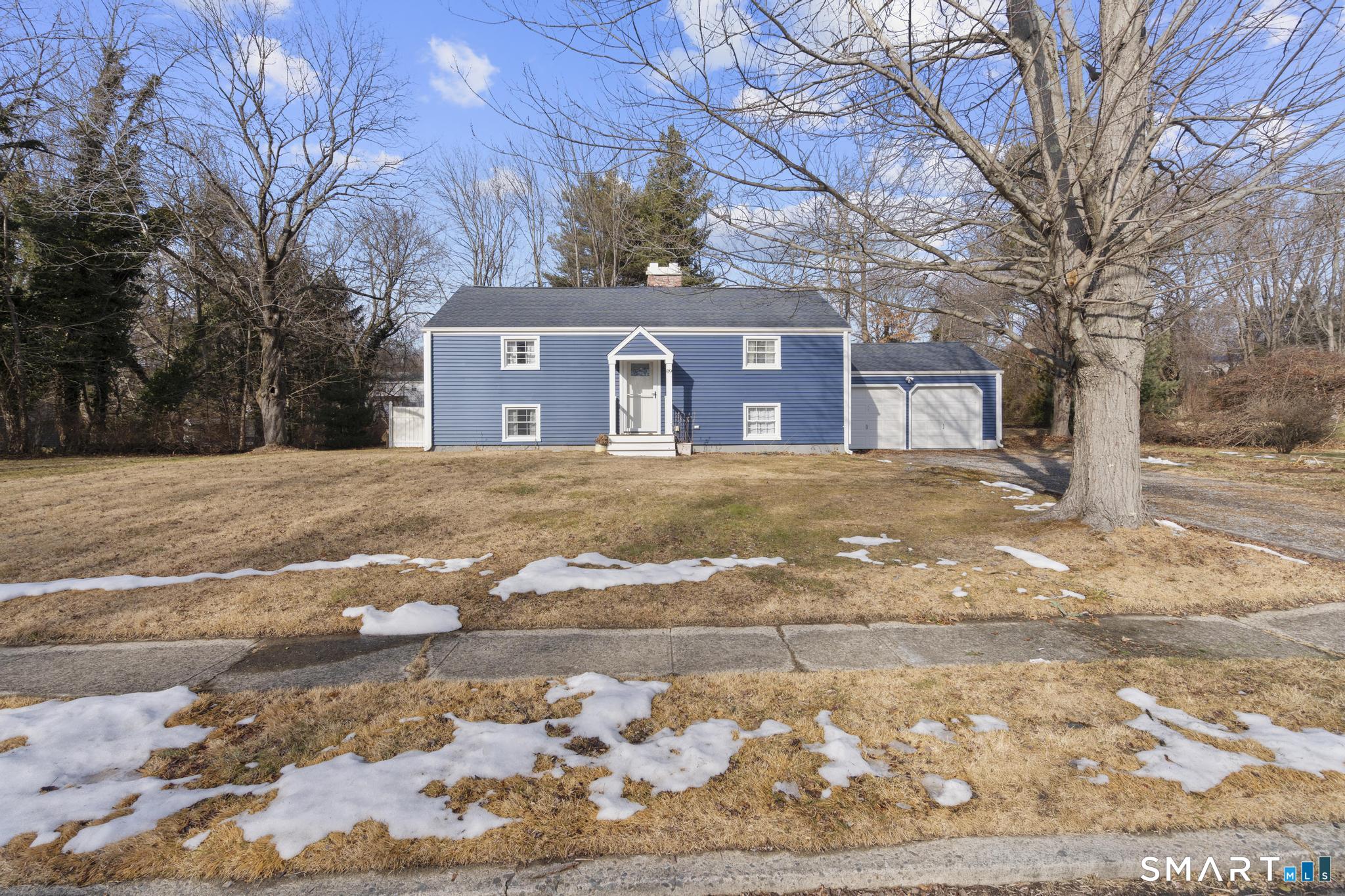89 Green Meadow Road Milford, CT 06461 - Photo 31 of 31 a front view of a house with a yard covered in snow