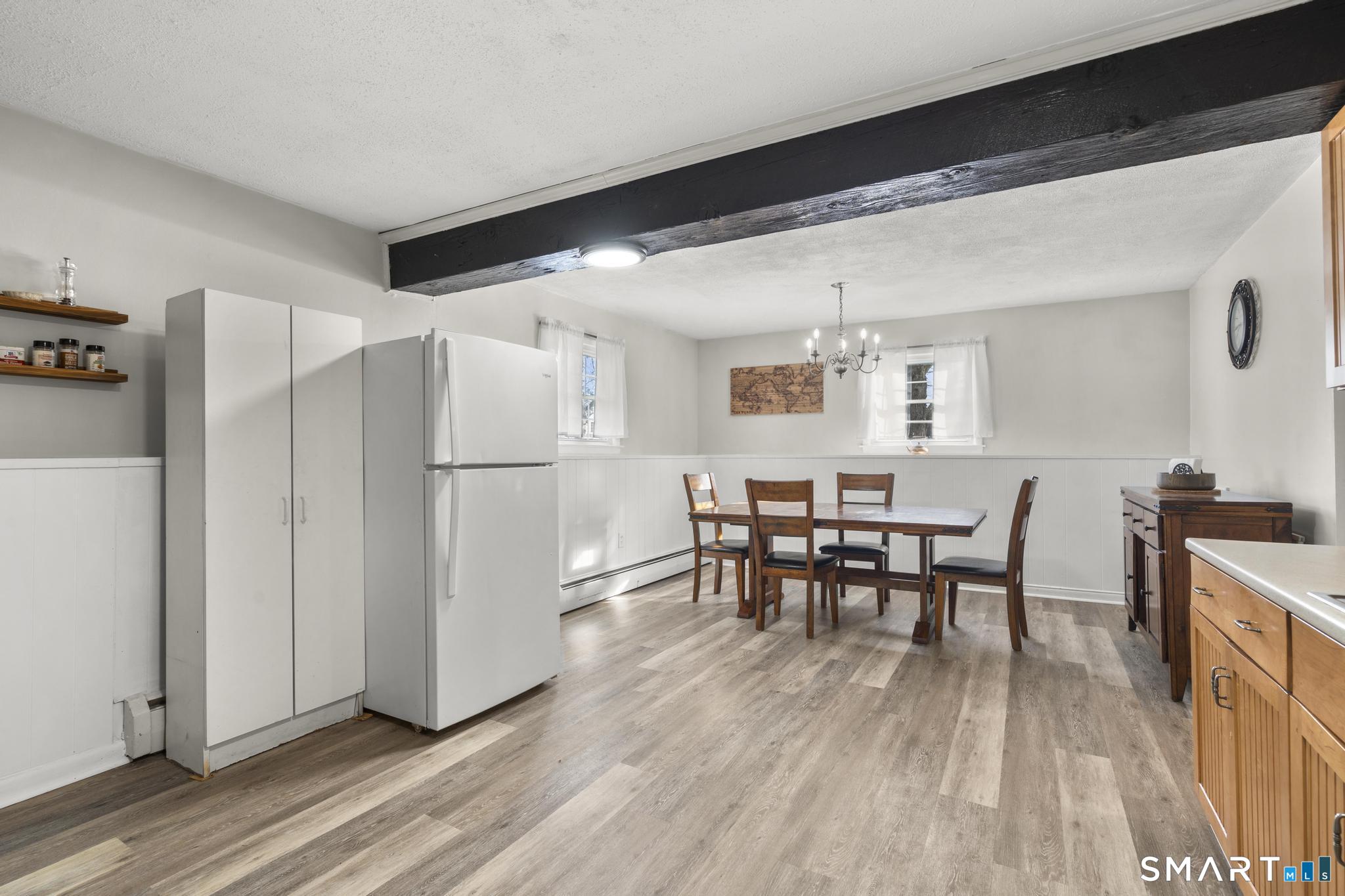 89 Green Meadow Road Milford, CT 06461 - Photo 9 of 31 a dining room with furniture and wooden floor
