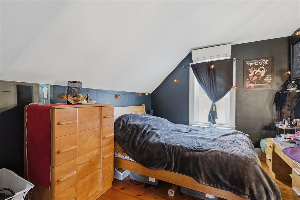 16 Evans Road, Unit 2 Marblehead, MA 01945 - Photo 9 of 24 a bedroom with a bed and dresser