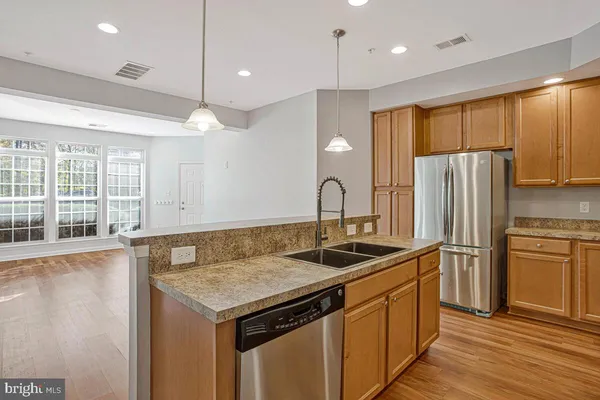 a kitchen with a stove and a sink