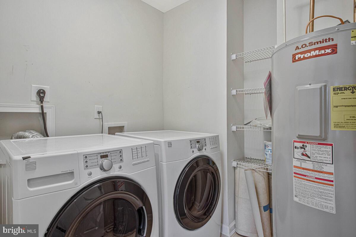 8049 Forest Ridge Drive, Unit 3 Chesapeake Beach, MD 20732 - Photo 16 of 40 a utility room with dryer and washer