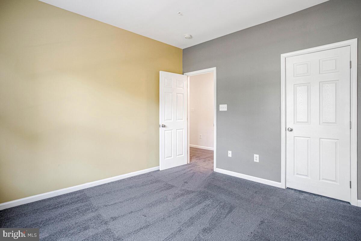 8049 Forest Ridge Drive, Unit 3 Chesapeake Beach, MD 20732 - Photo 17 of 40 a view of an empty room