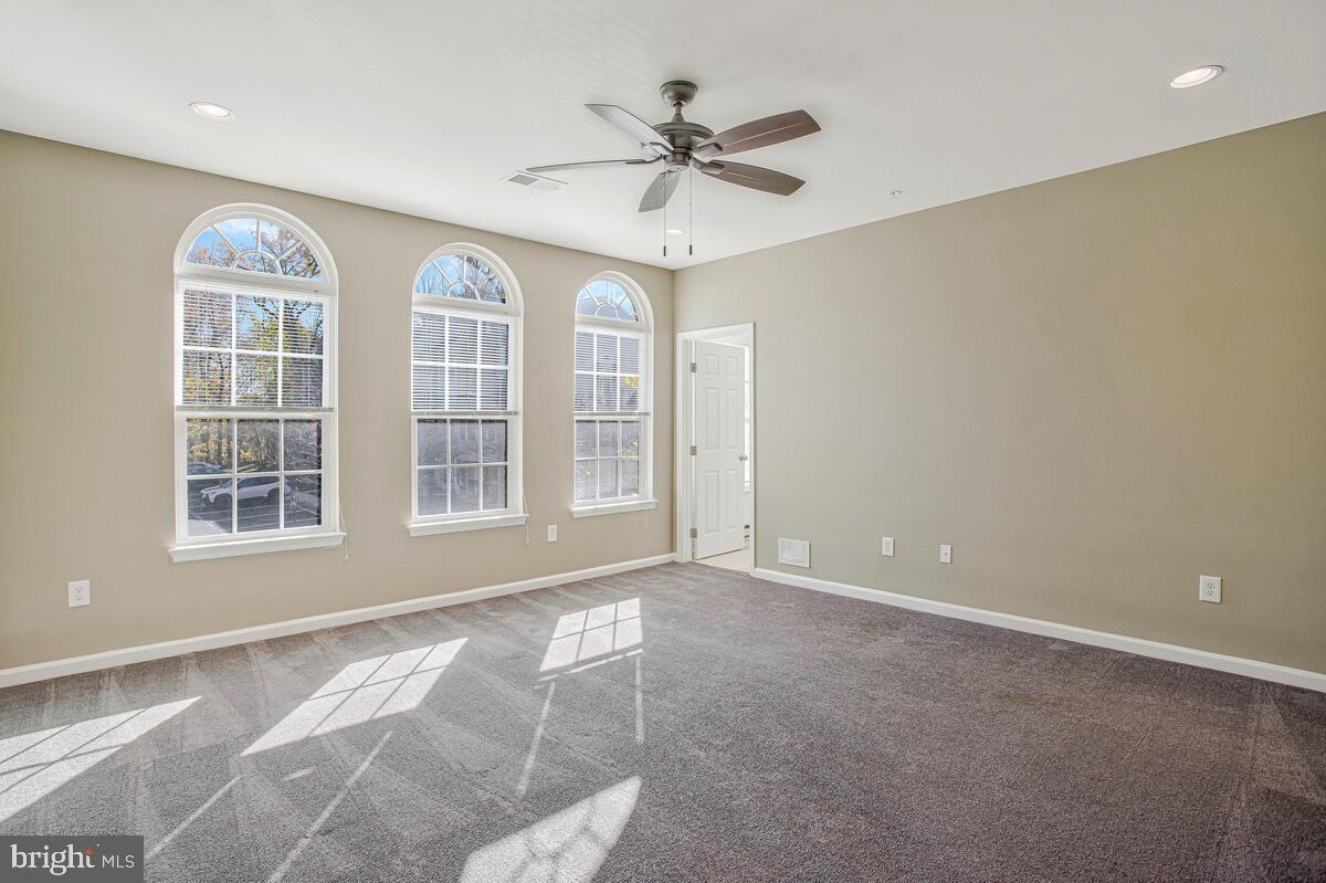 8049 Forest Ridge Drive, Unit 3 Chesapeake Beach, MD 20732 - Photo 27 of 40 a view of an empty room with a window