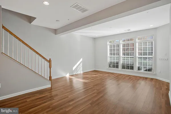 a view of a kitchen with wooden floor