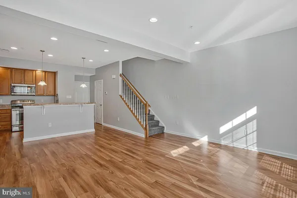 a view of a kitchen with wooden floor
