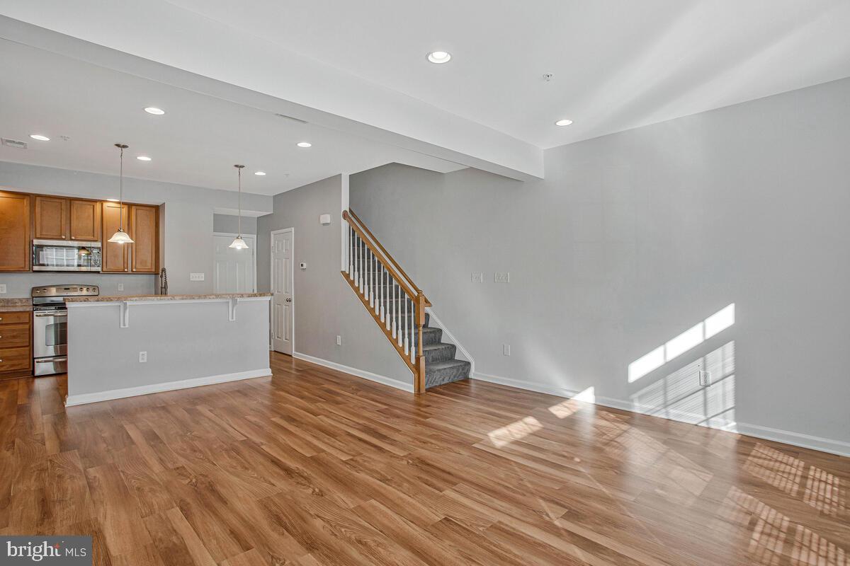 8049 Forest Ridge Drive, Unit 3 Chesapeake Beach, MD 20732 - Photo 8 of 40 a view of a kitchen with wooden floor