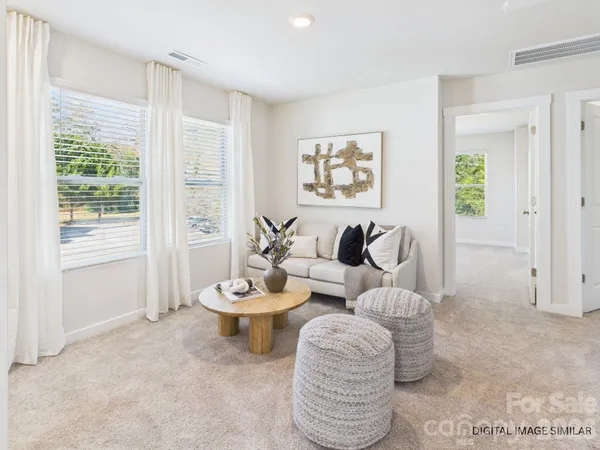 a living room with furniture and a rug