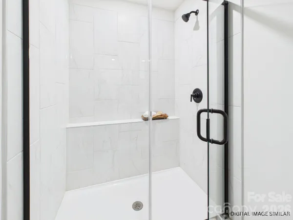 a view of a house with a yard and a large tree