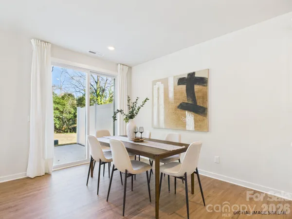 a living room with furniture potted plant and a window