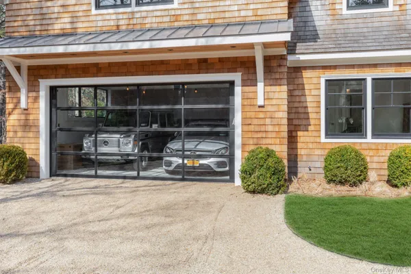 a view of a house with a patio and a yard