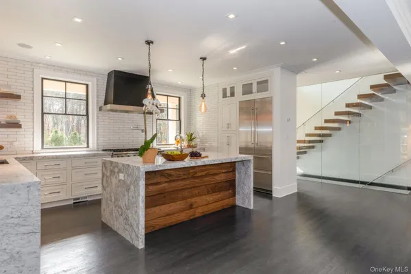 a room with lot of cabinets and wooden floor