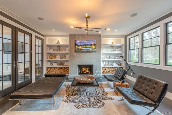 a living room with furniture rug and window