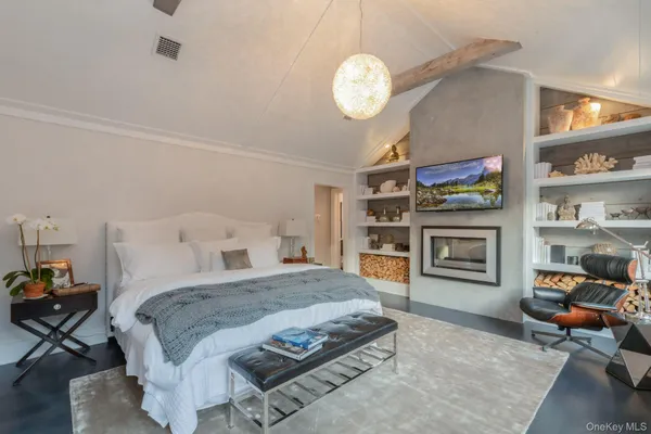 a bedroom with a bed and dresser