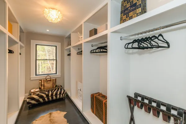 a bedroom with bed and a window