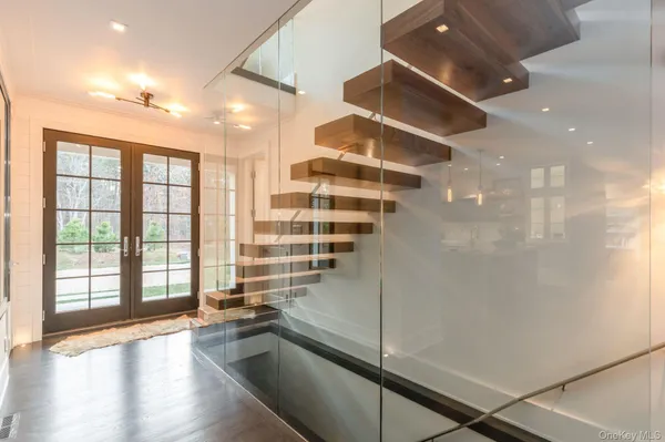 a view of entryway with wooden floor