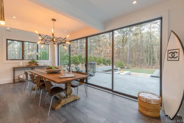 a view of a dining room with furniture window and wooden floor
