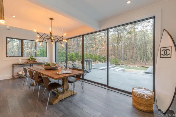 a view of a dining room with furniture window and wooden floor
