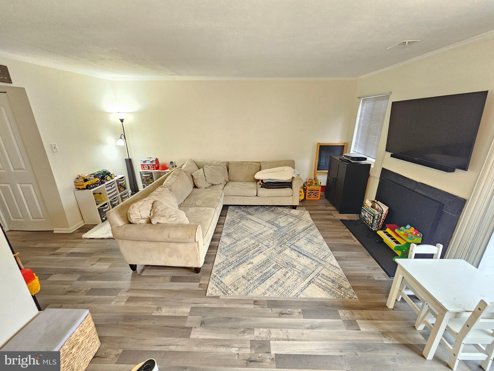 17445 Hoskinson Road Poolesville, MD 20837 - Photo 14 of 36 a living room with furniture and a flat screen tv