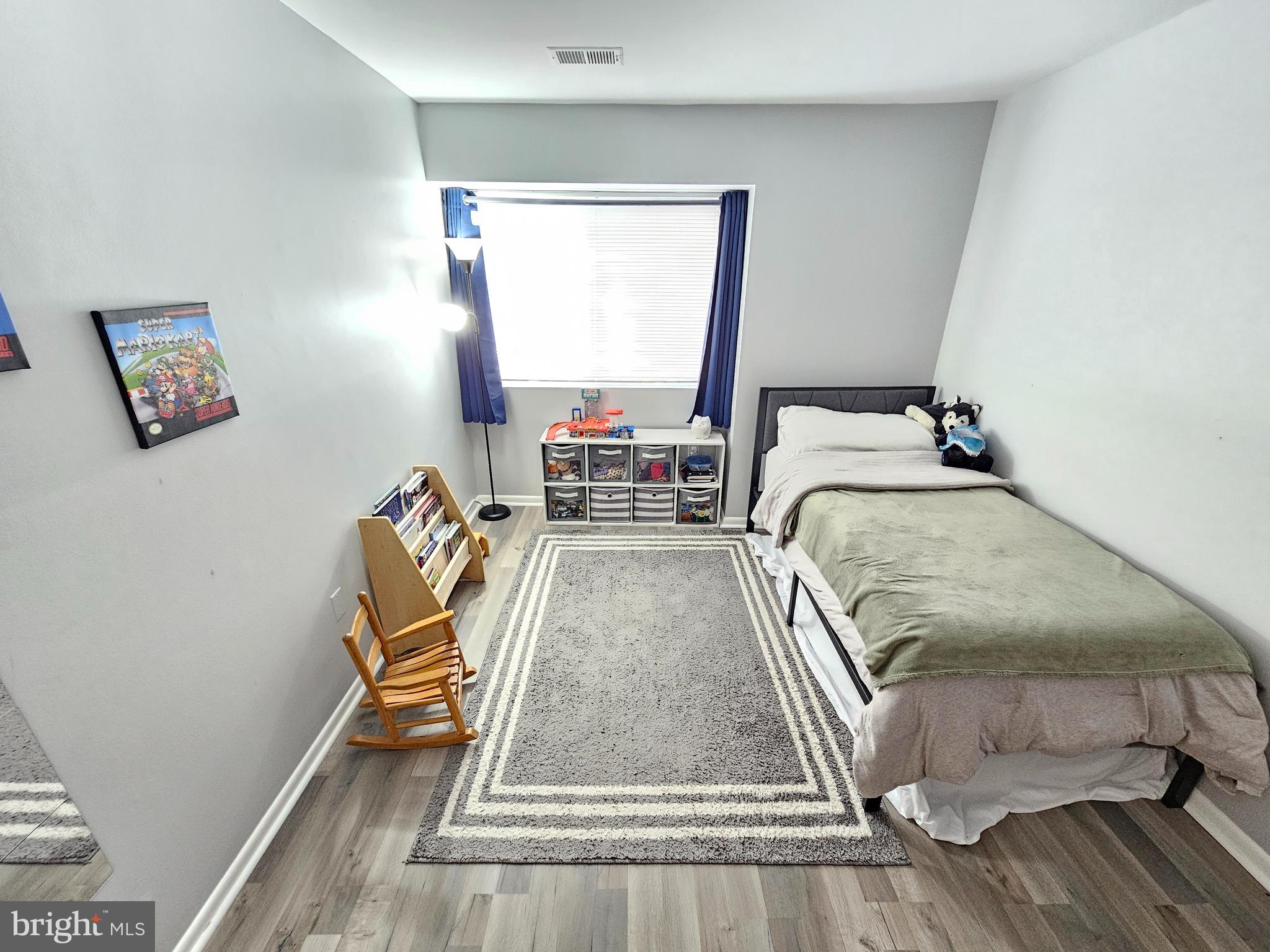 17445 Hoskinson Road Poolesville, MD 20837 - Photo 23 of 36 a bedroom with a bed and a window