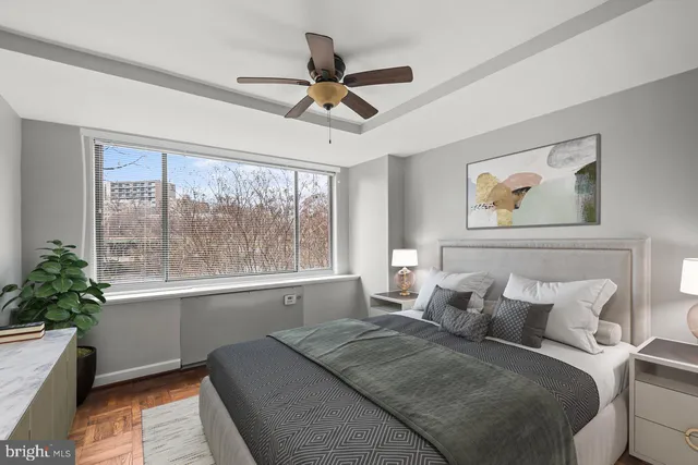 a bedroom with a large bed and a window