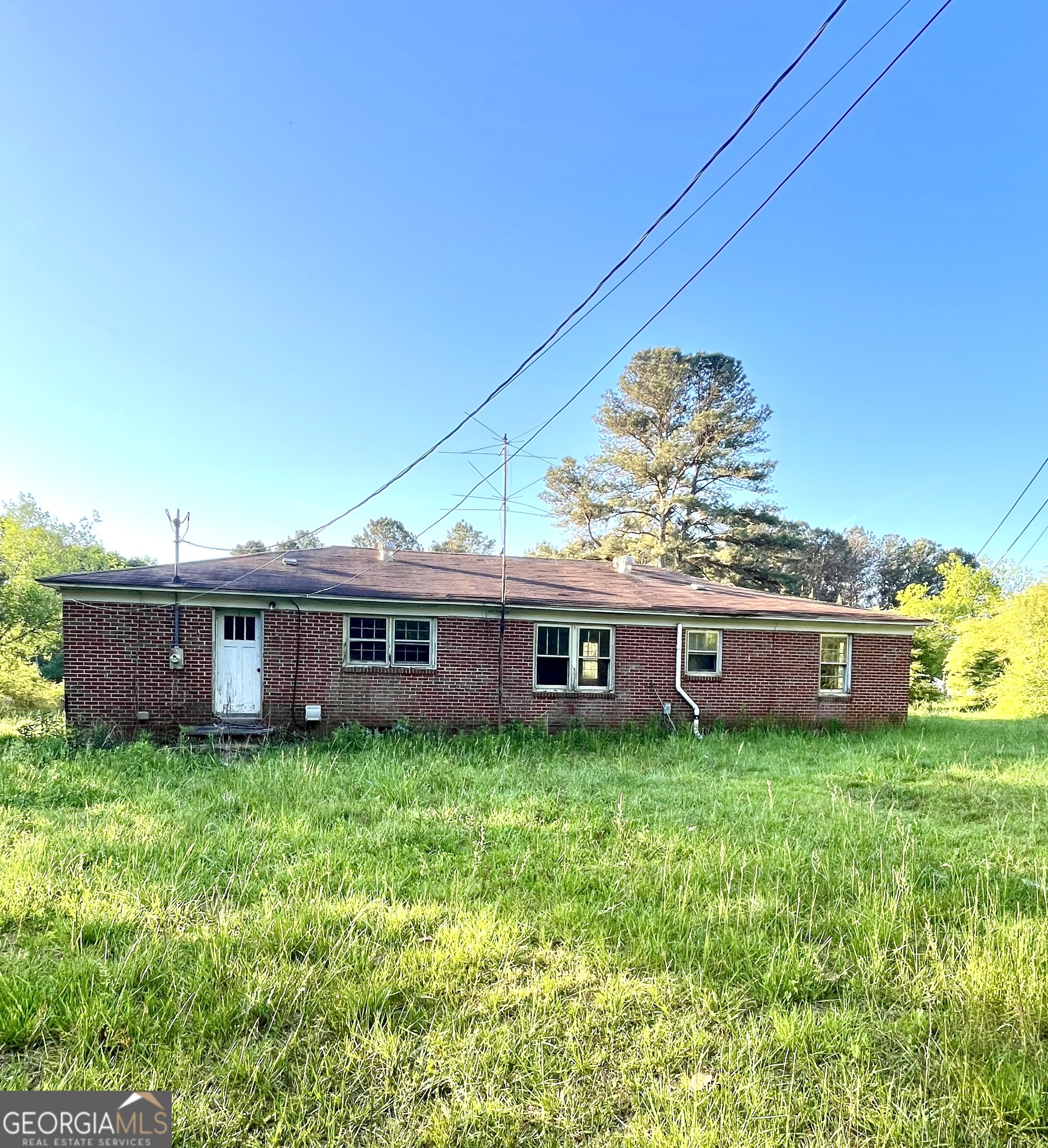 3658 West Point Road LaGrange, GA 30240 - Photo 2 of 7 a view of a house with a big yard and large trees