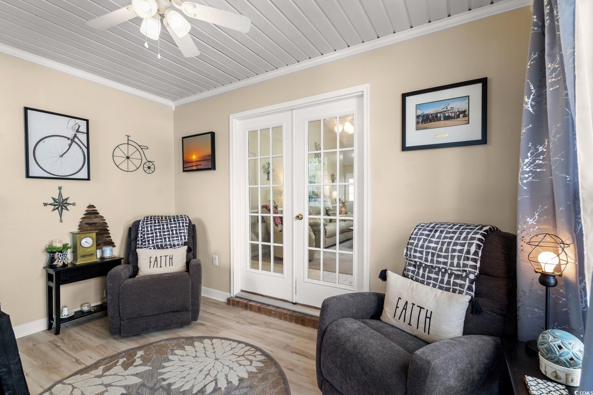 9533 Sullivan Drive Murrells Inlet, SC 29576 - Photo 19 of 40 Living area featuring crown molding, wood finished floors, french doors, and ceiling fan