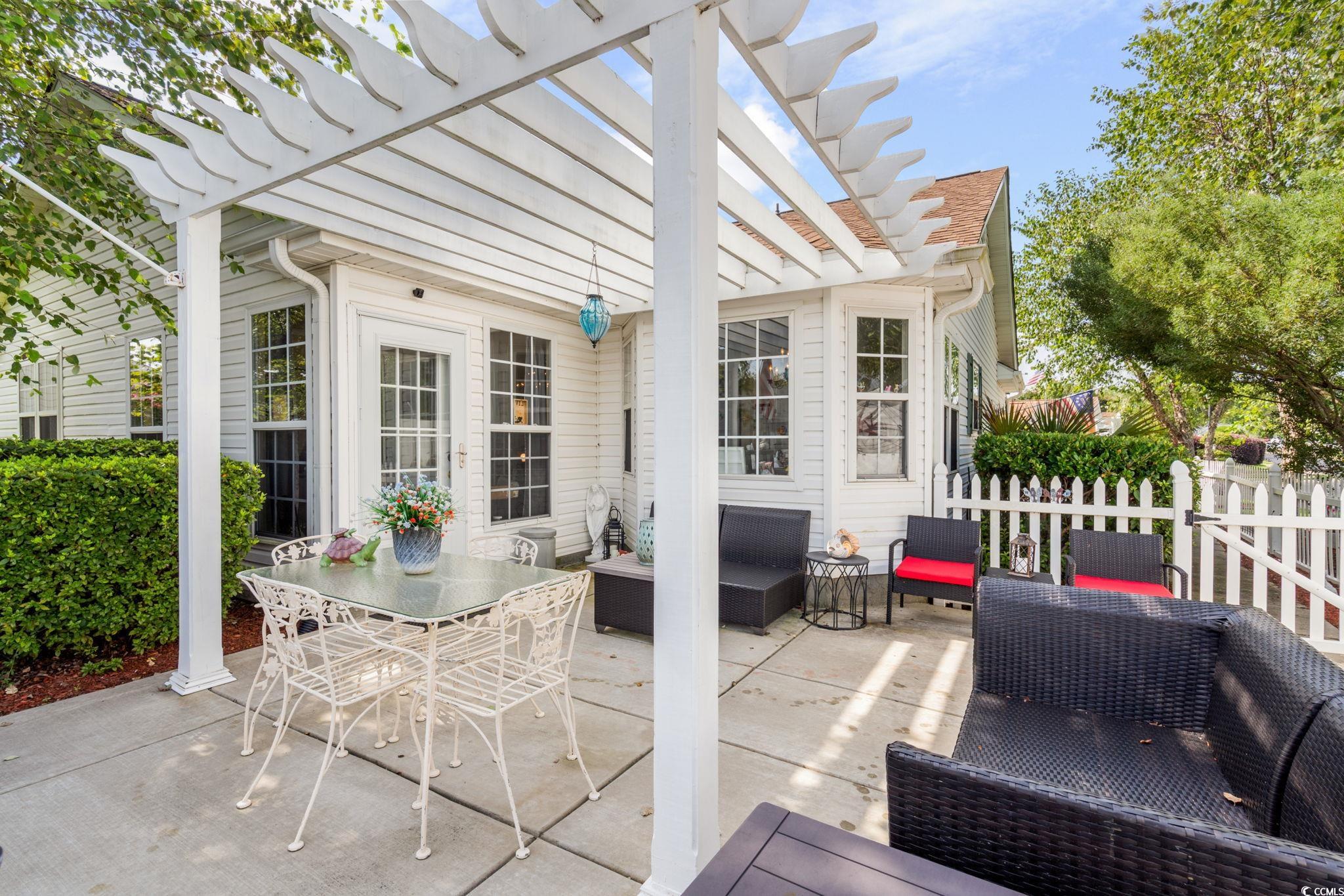 9533 Sullivan Drive Murrells Inlet, SC 29576 - Photo 22 of 40 View of patio / terrace featuring outdoor lounge area and a pergola