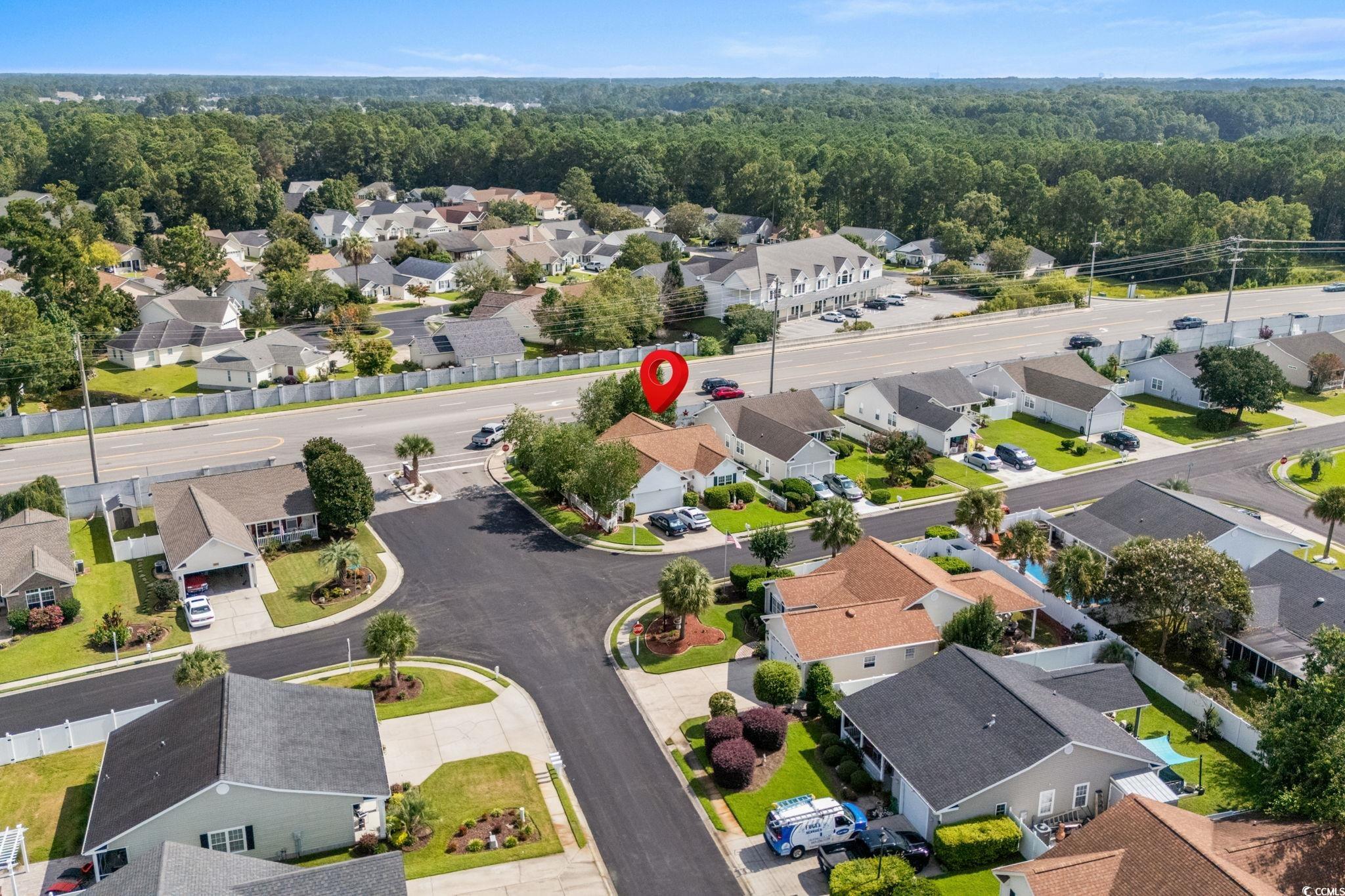 9533 Sullivan Drive Murrells Inlet, SC 29576 - Photo 3 of 40 Aerial perspective of suburban area featuring a forest