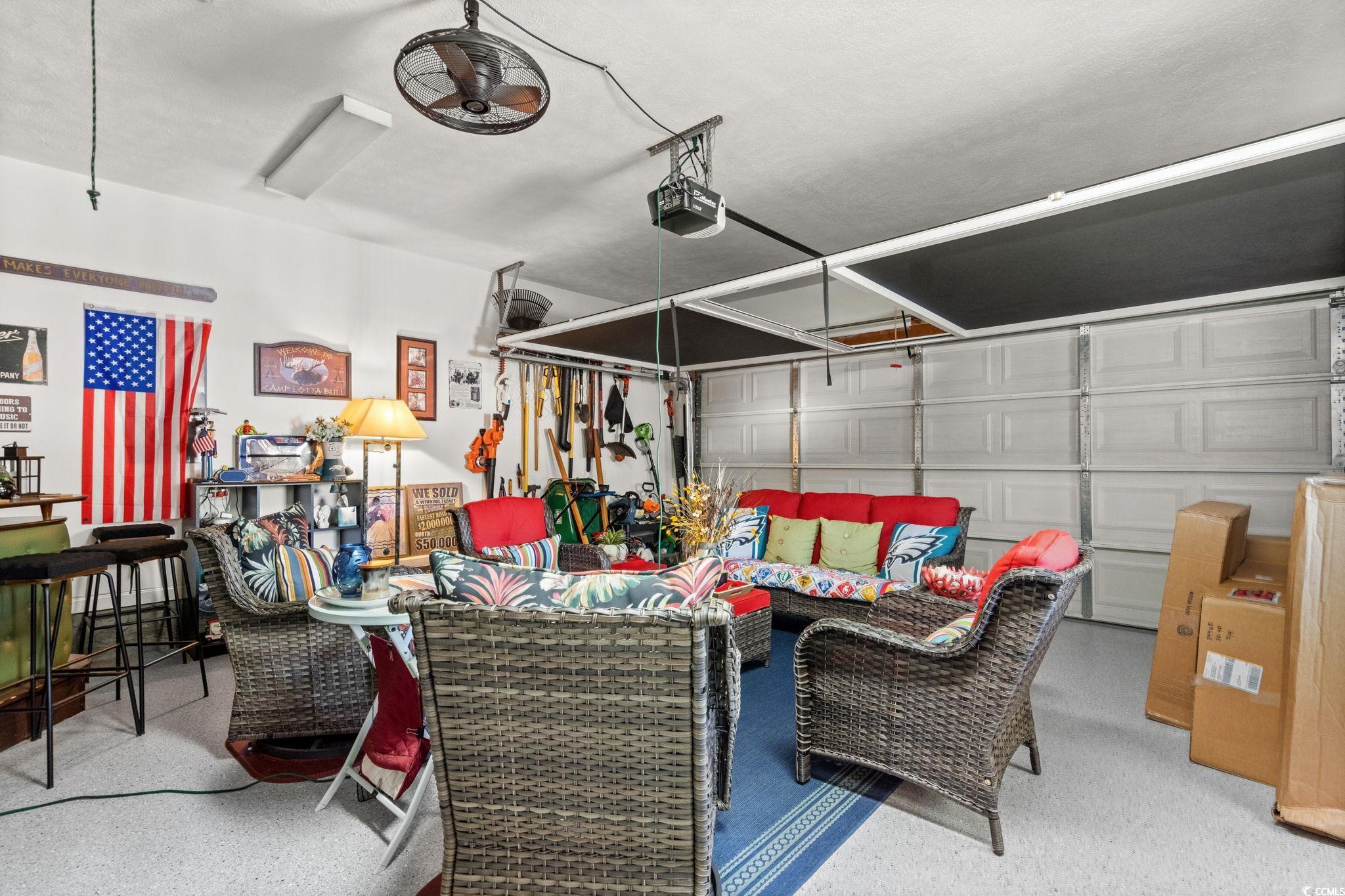 9533 Sullivan Drive Murrells Inlet, SC 29576 - Photo 36 of 40 Garage with a garage door opener