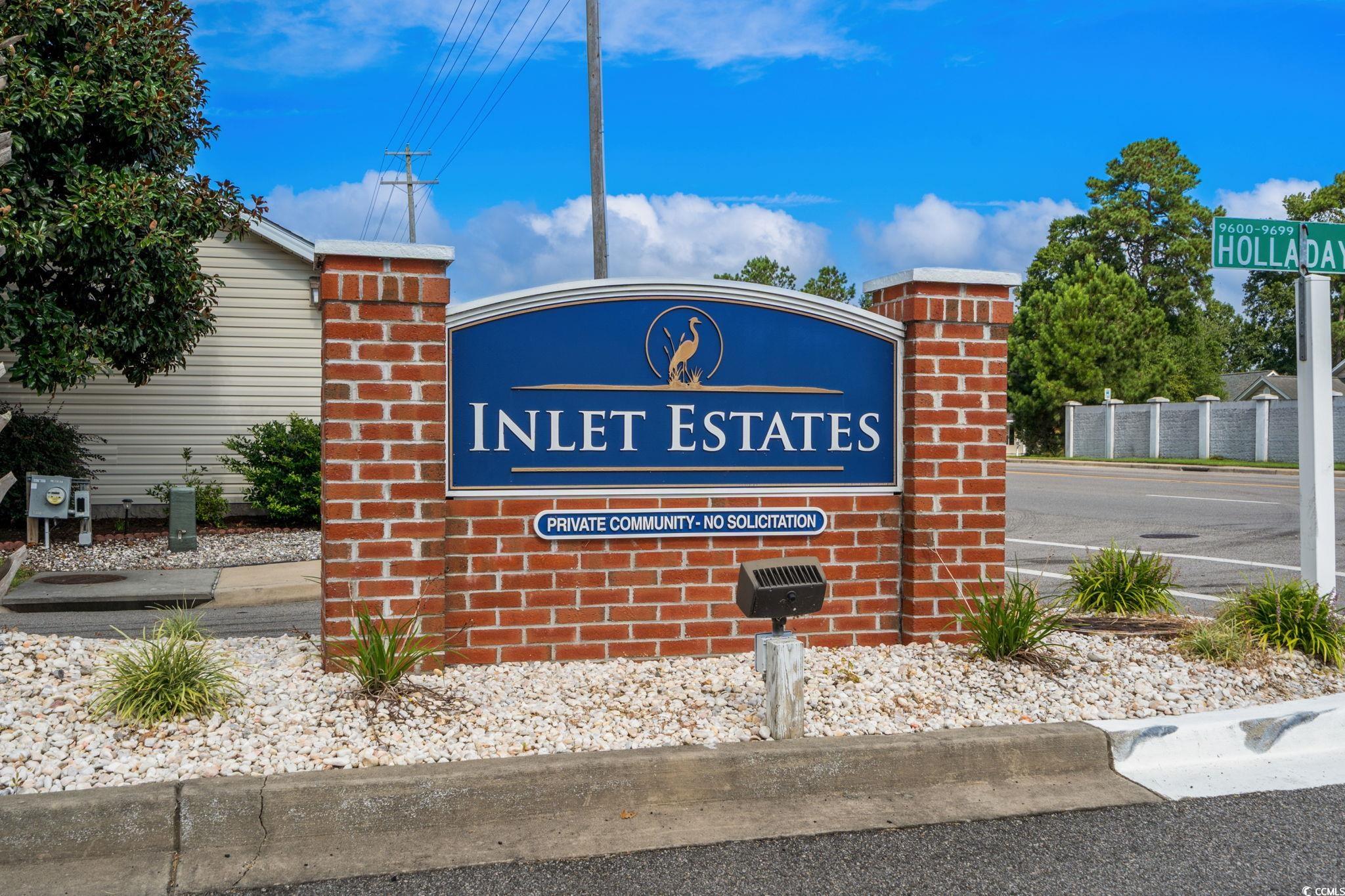 9533 Sullivan Drive Murrells Inlet, SC 29576 - Photo 40 of 40 Community sign featuring uncovered parking