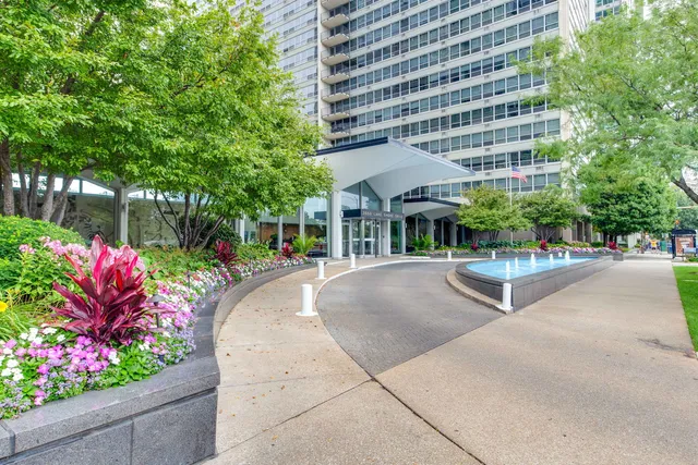 a view of a patio with table and chairs and potted plants