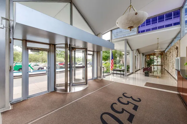 a room with furniture and a large window