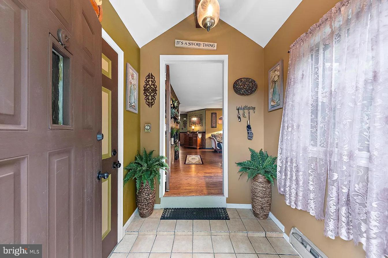22 Fir Road Manahawkin, NJ 08050 - Photo 34 of 35 a view of a entryway door of the house