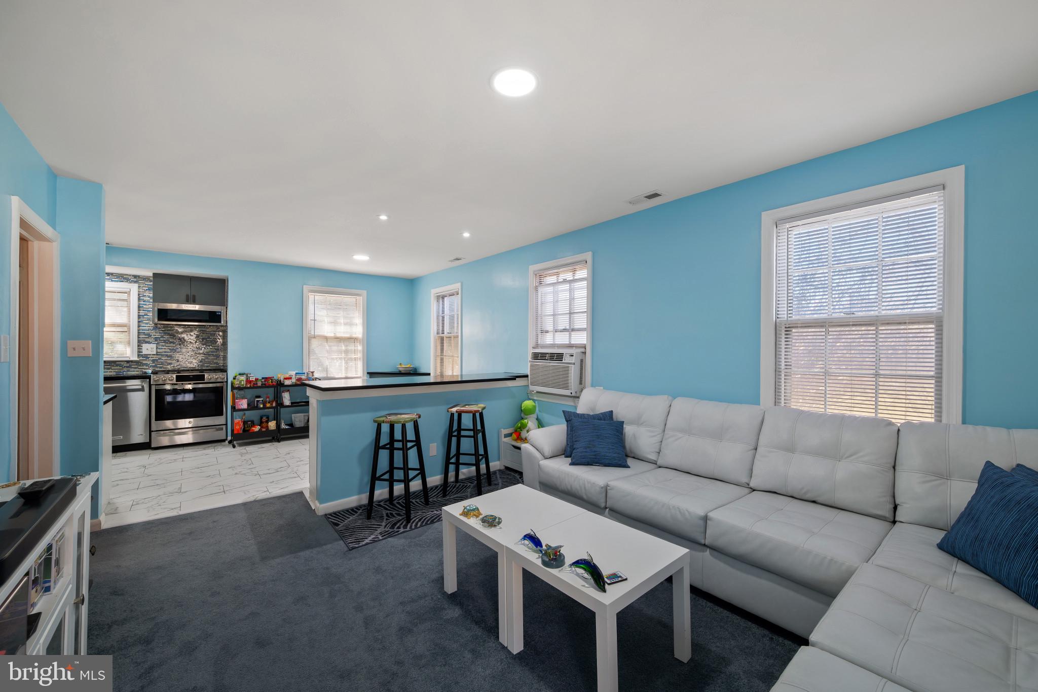 4235 Old Milford Mill Road Baltimore, MD 21208 - Photo 1 of 29 a living room with furniture and wooden floor