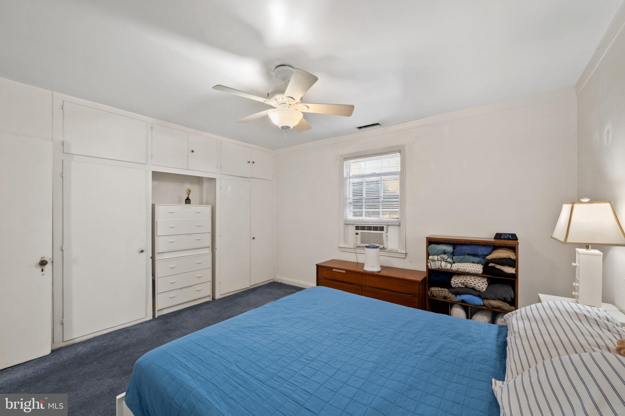 4235 Old Milford Mill Road Baltimore, MD 21208 - Photo 15 of 29 a bedroom with a bed and a chandelier