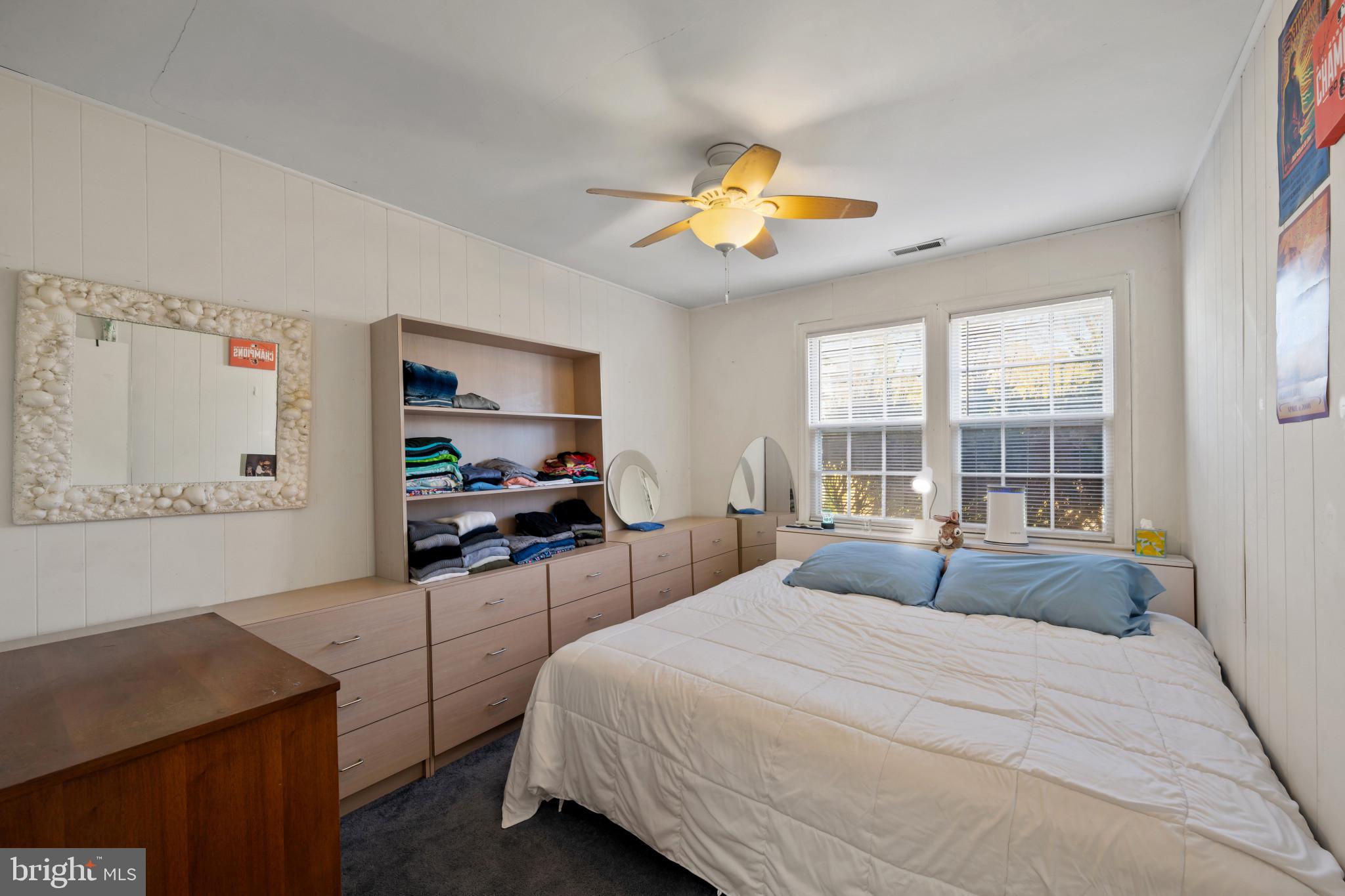 4235 Old Milford Mill Road Baltimore, MD 21208 - Photo 16 of 29 a bedroom with a bed and a desk