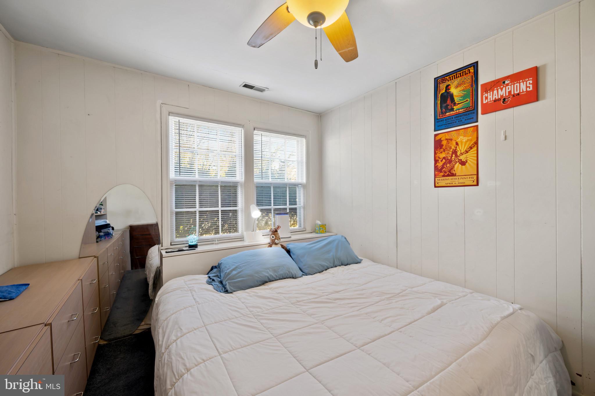 4235 Old Milford Mill Road Baltimore, MD 21208 - Photo 17 of 29 a bedroom with a bed and a large window