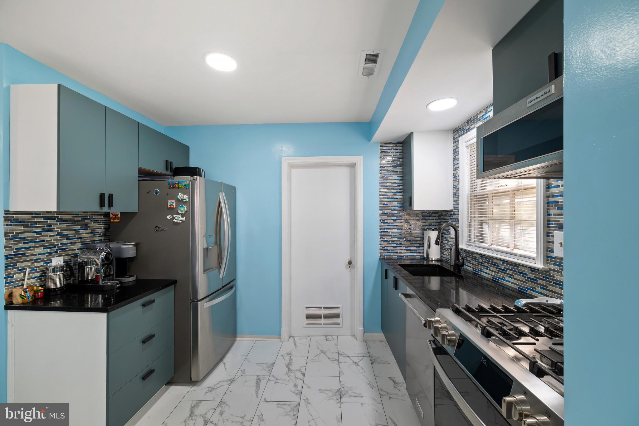 4235 Old Milford Mill Road Baltimore, MD 21208 - Photo 2 of 29 a kitchen with stainless steel appliances granite countertop a refrigerator and a stove
