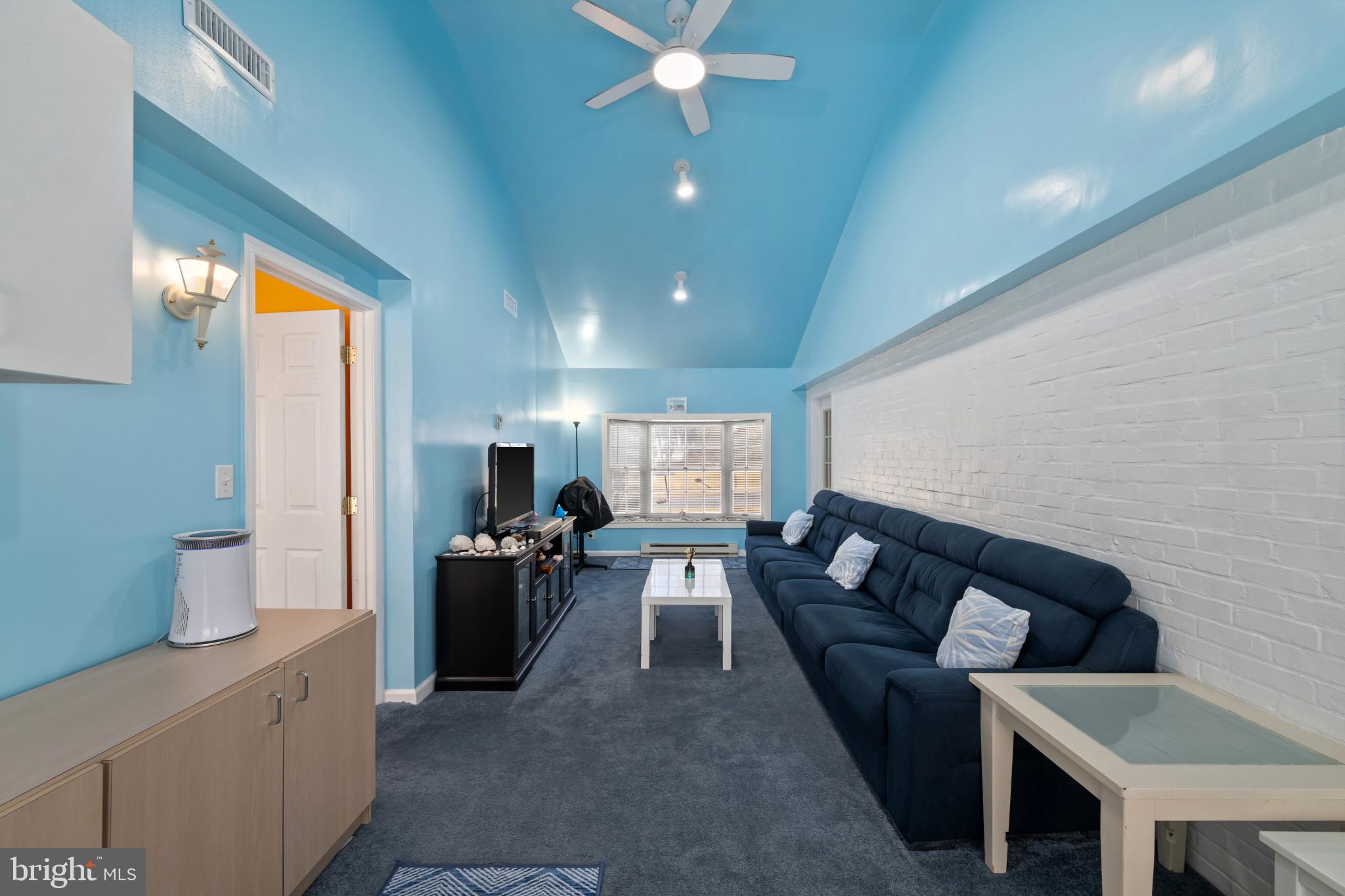 4235 Old Milford Mill Road Baltimore, MD 21208 - Photo 21 of 29 a living room with furniture and a wooden floor