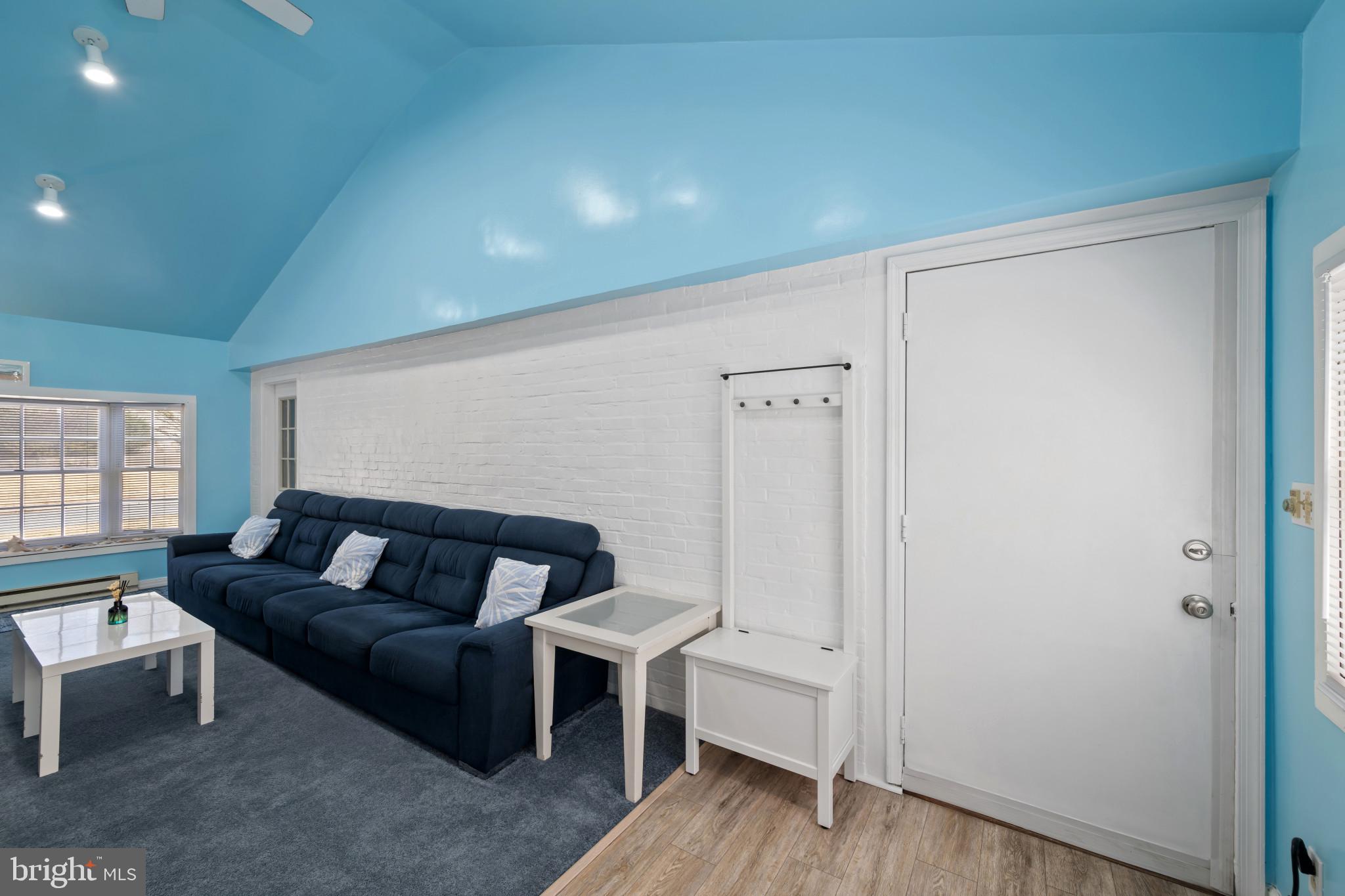 4235 Old Milford Mill Road Baltimore, MD 21208 - Photo 22 of 29 a living room with furniture and a wooden floor