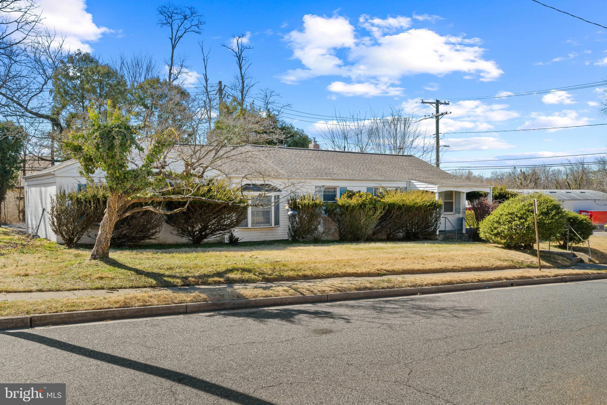 4235 Old Milford Mill Road Baltimore, MD 21208 - Photo 25 of 29 a front view of a house with garden