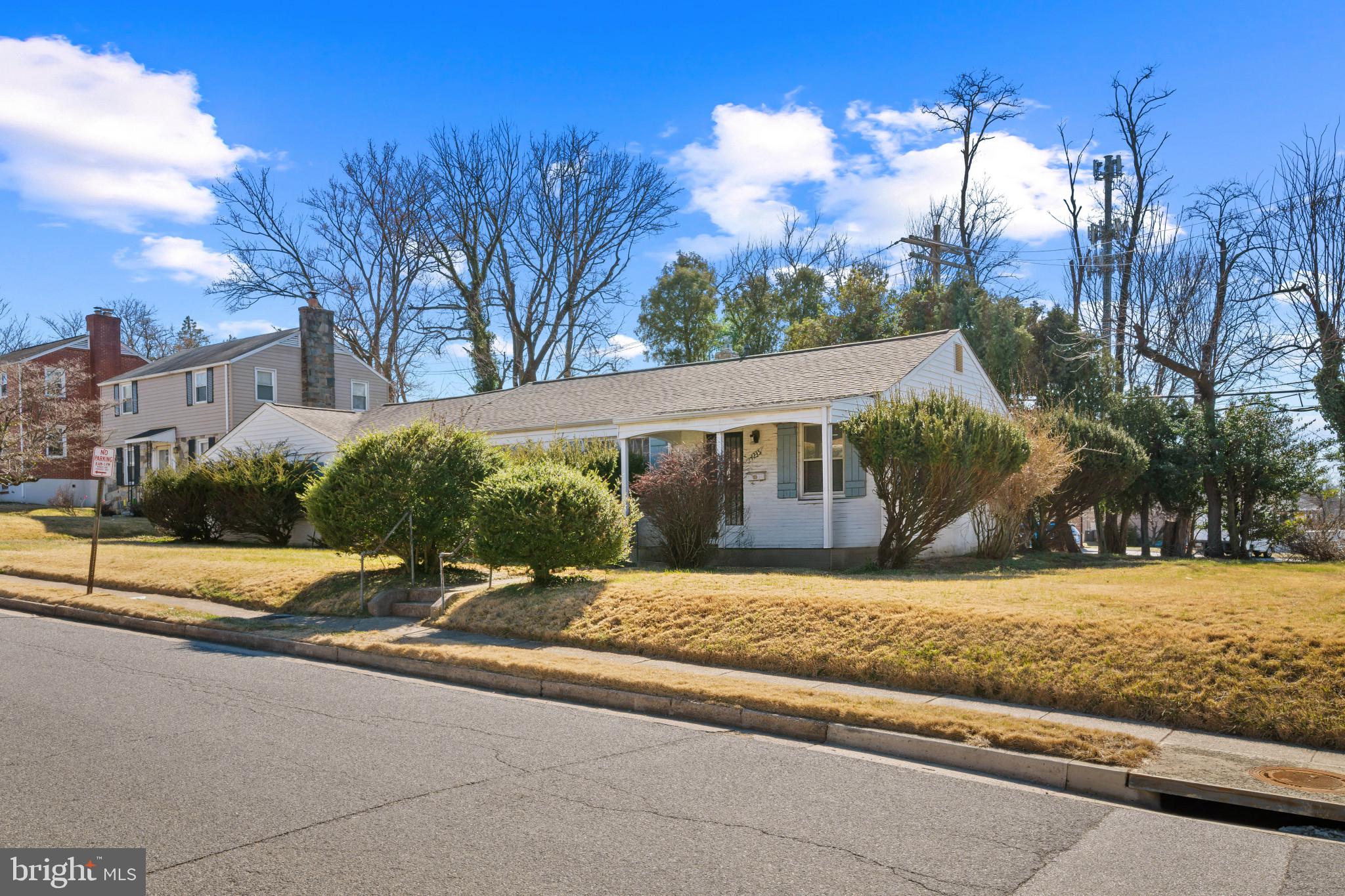 4235 Old Milford Mill Road Baltimore, MD 21208 - Photo 27 of 29 a view of a house next to a yard with road