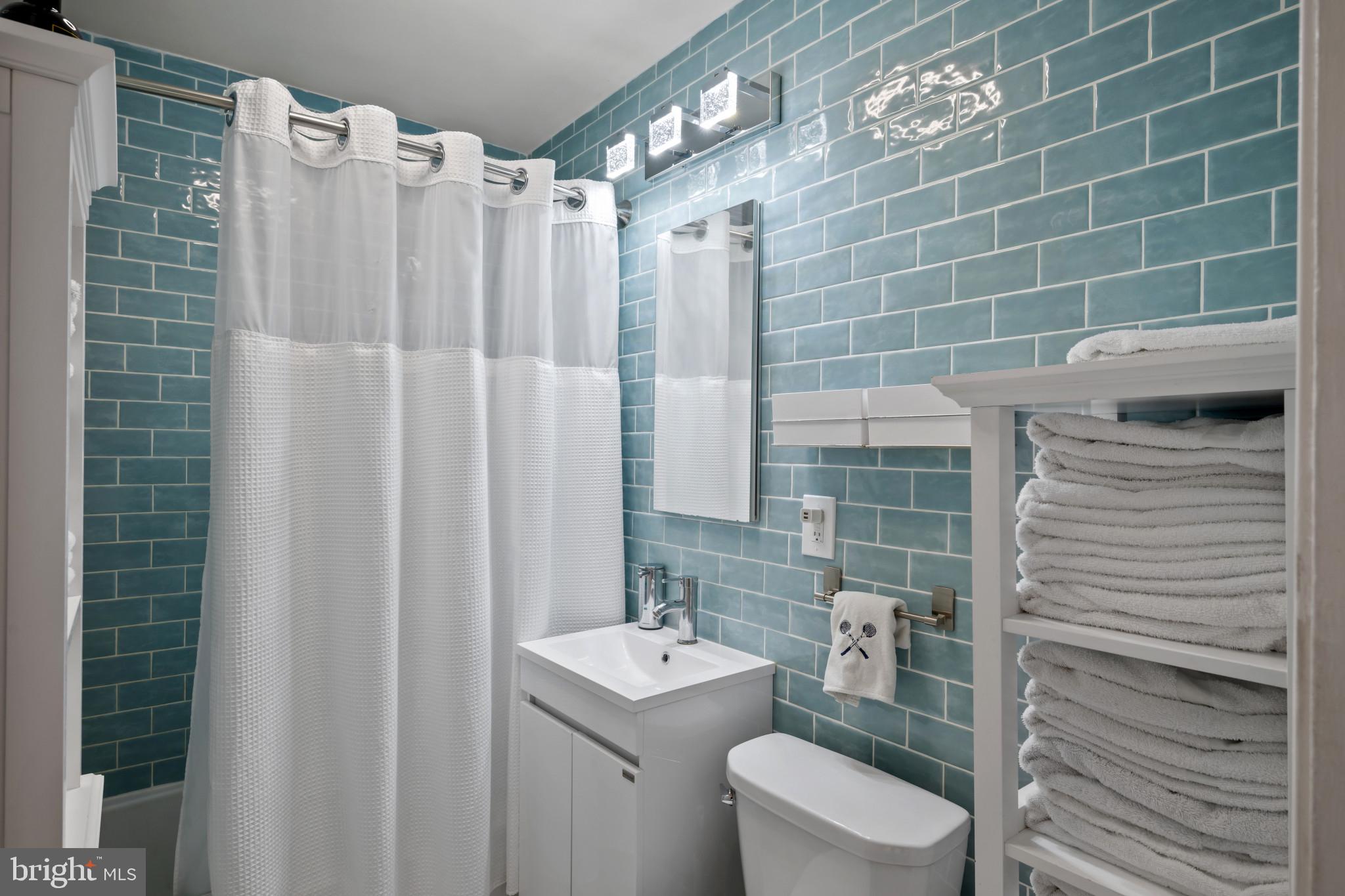 4235 Old Milford Mill Road Baltimore, MD 21208 - Photo 3 of 29 a bathroom with a toilet a sink and shower
