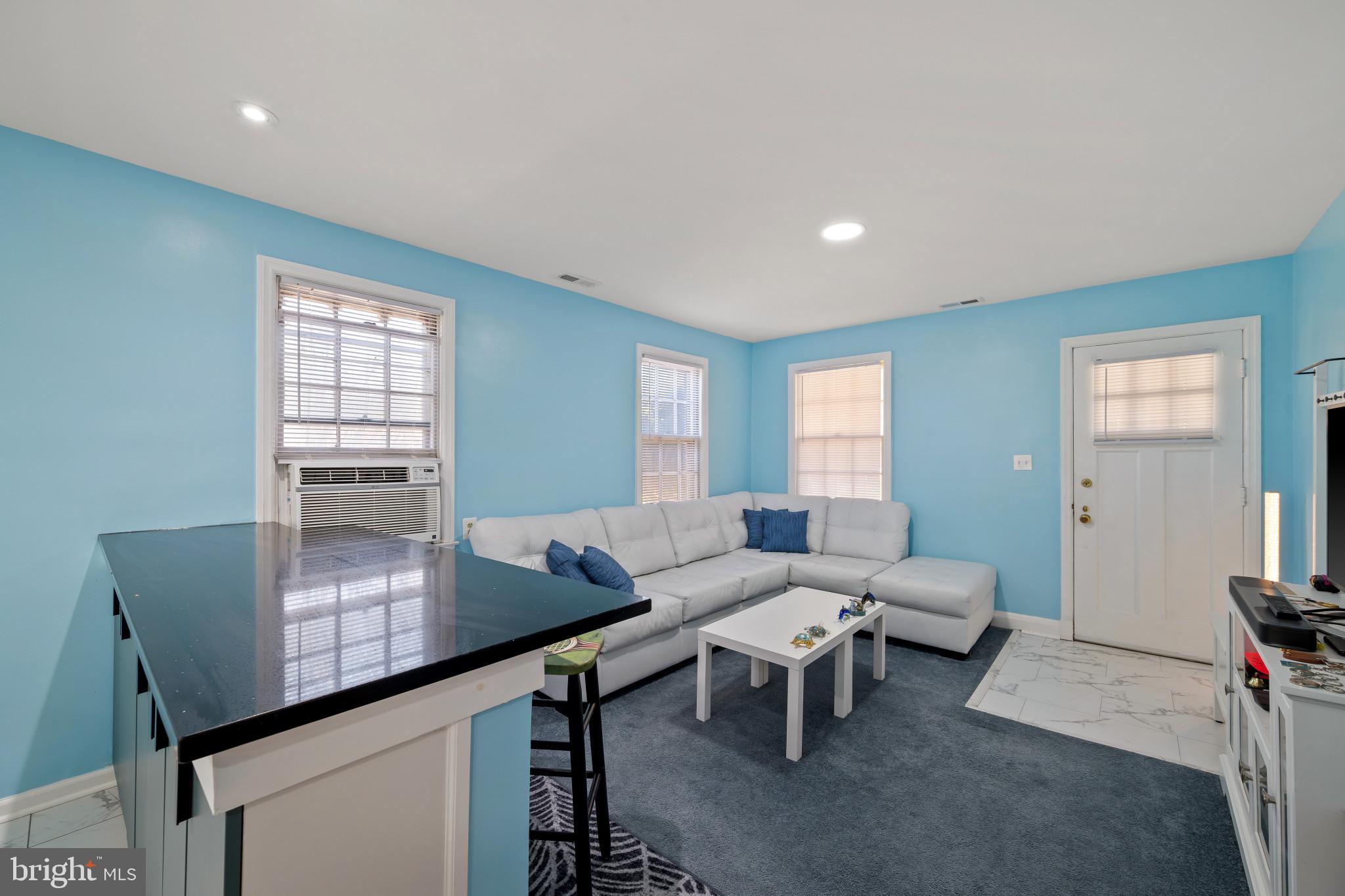 4235 Old Milford Mill Road Baltimore, MD 21208 - Photo 5 of 29 a living room with furniture and wooden floor
