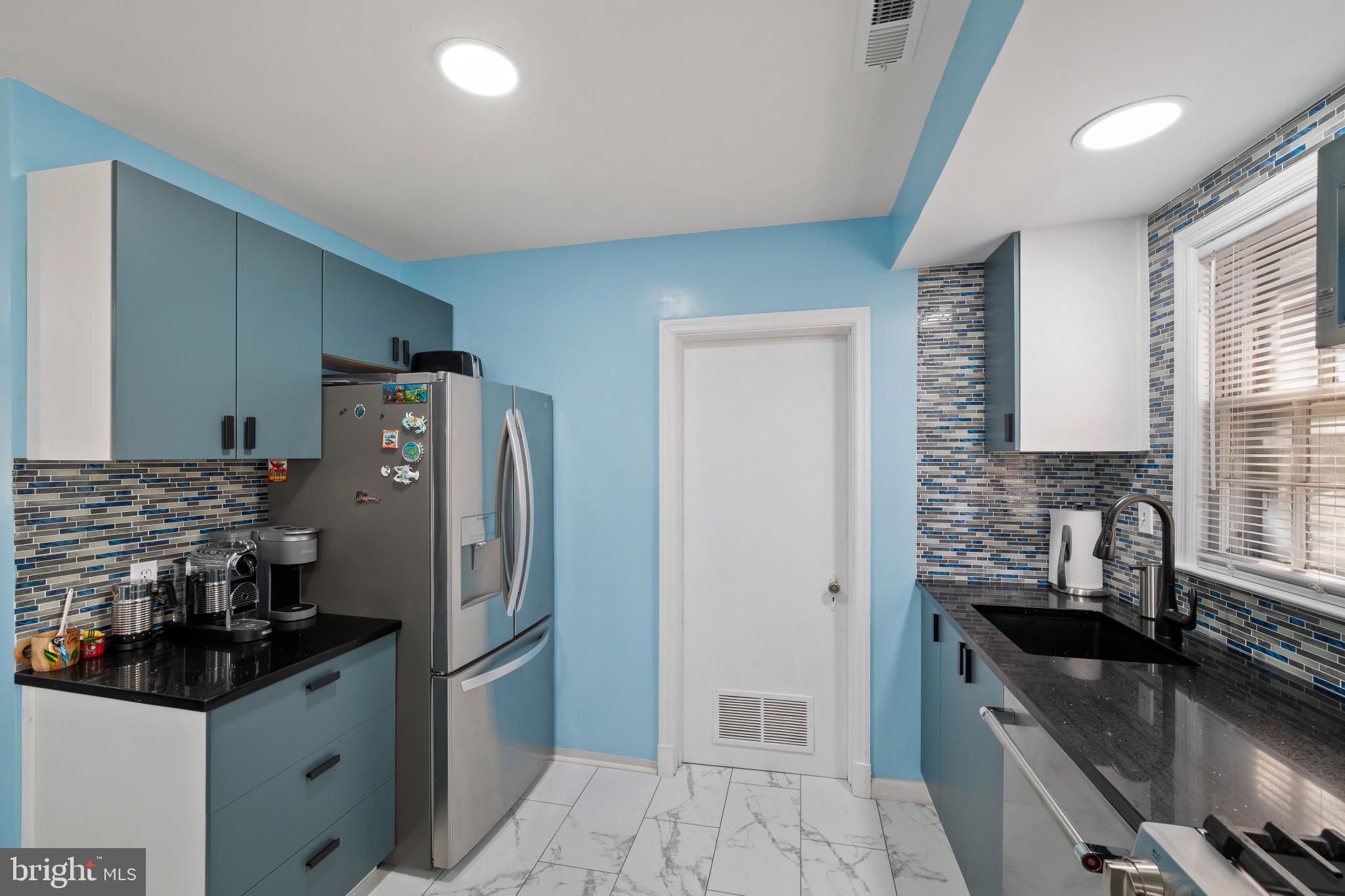 4235 Old Milford Mill Road Baltimore, MD 21208 - Photo 9 of 29 a kitchen with stainless steel appliances granite countertop a sink stove and refrigerator